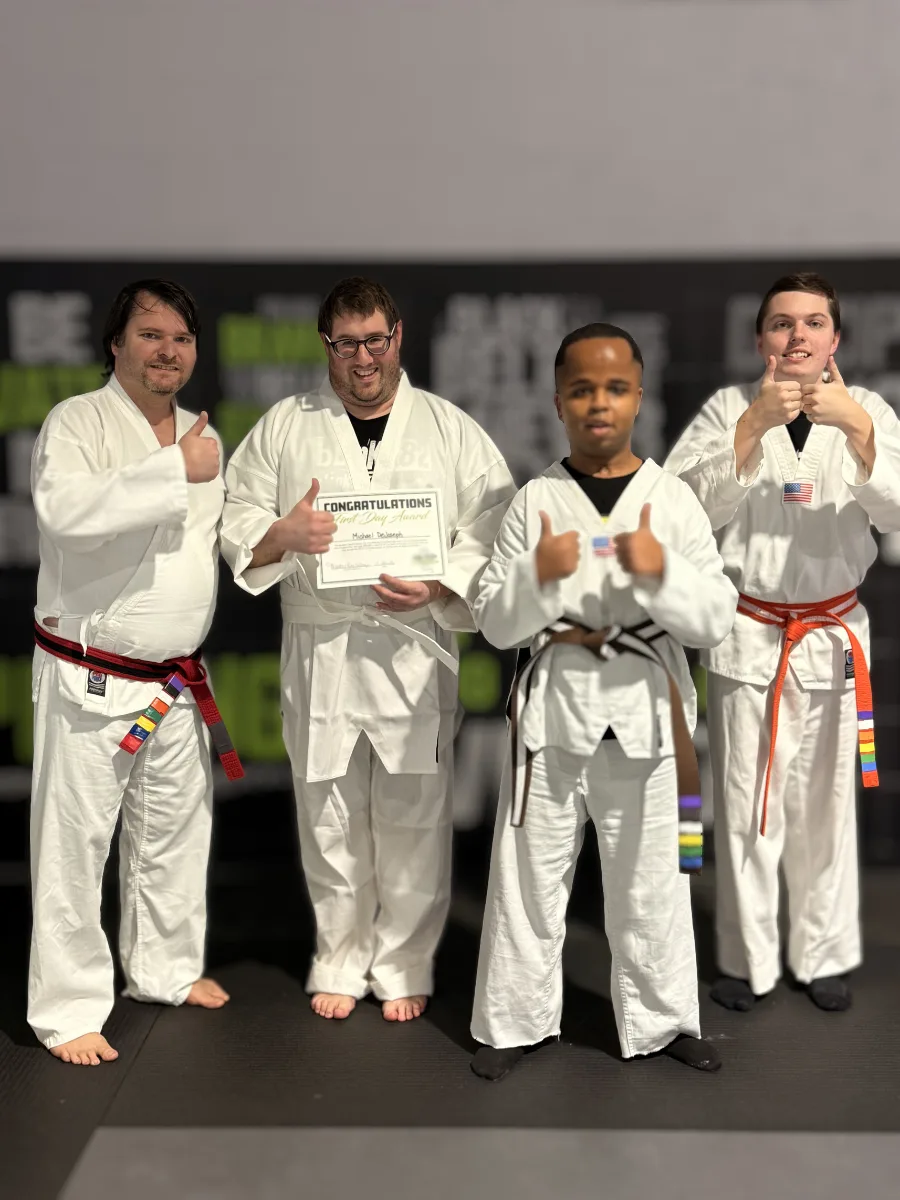 Special Abilities students giving a thumbs-up in their uniforms at Rise Up NJ