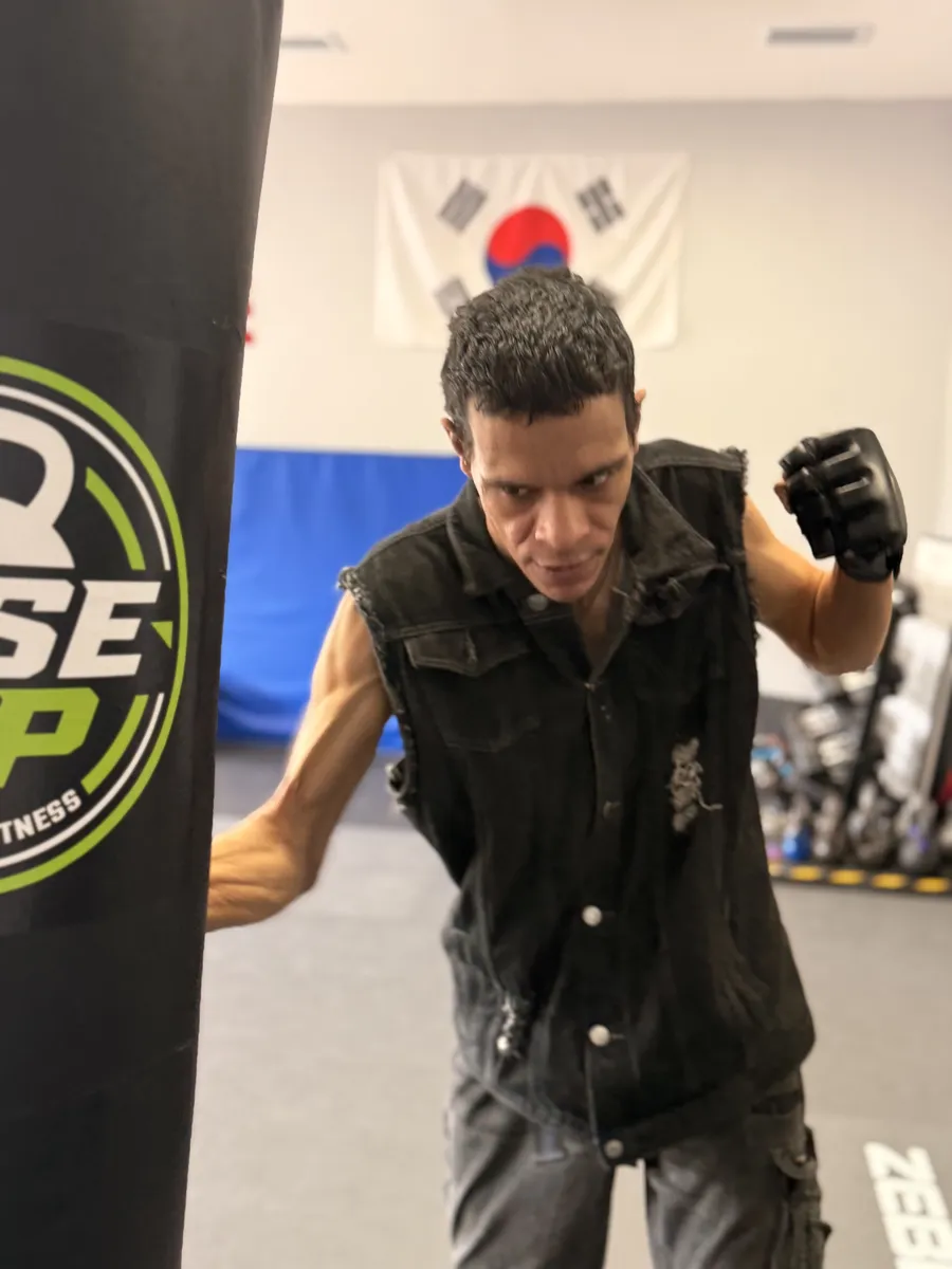 Special Abilities student training on the heavy bag at Rise Up NJ in Atco