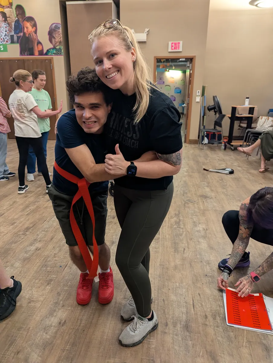 Rise Up NJ coach celebrating with a Special Abilities student